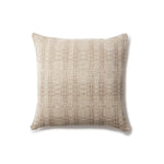 Handwoven pillow in a subtle geometric design in shades of brown and cream. 