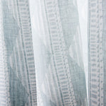 Close-up sheer linen fabric swatch in a horizontal stripe pattern broken with triangluar shapes, in shades of gray.