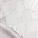 Draped fabric yardage in a watercolor watercolor print in shades of gray and purple on a white field.