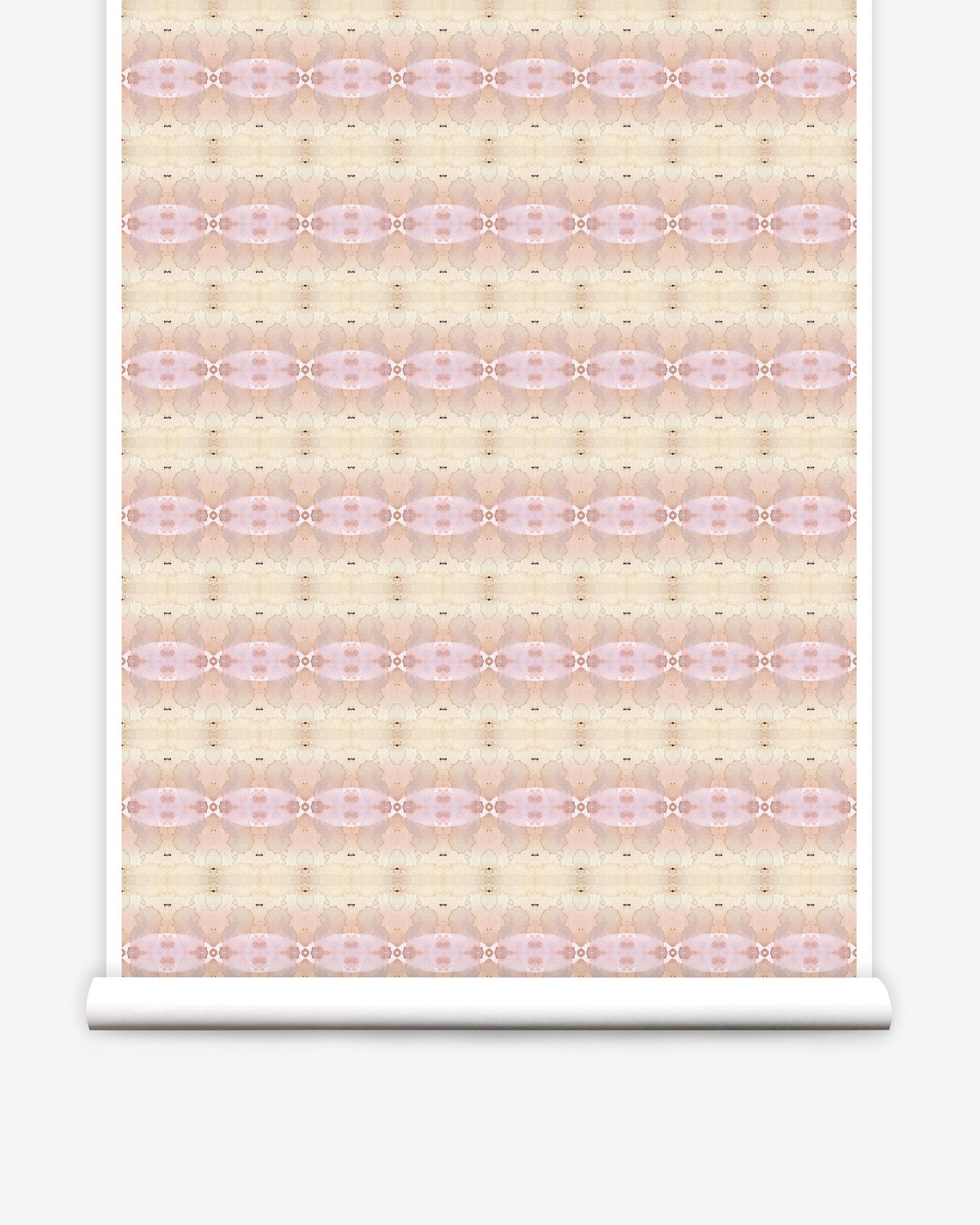 Partially unrolled wallpaper yardage in a gridded paint splatter print in shades of pink, yellow, cream and white.