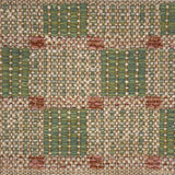 Textural flatweave rug in a checkerboard pattern in green and tan with blush pink accents.