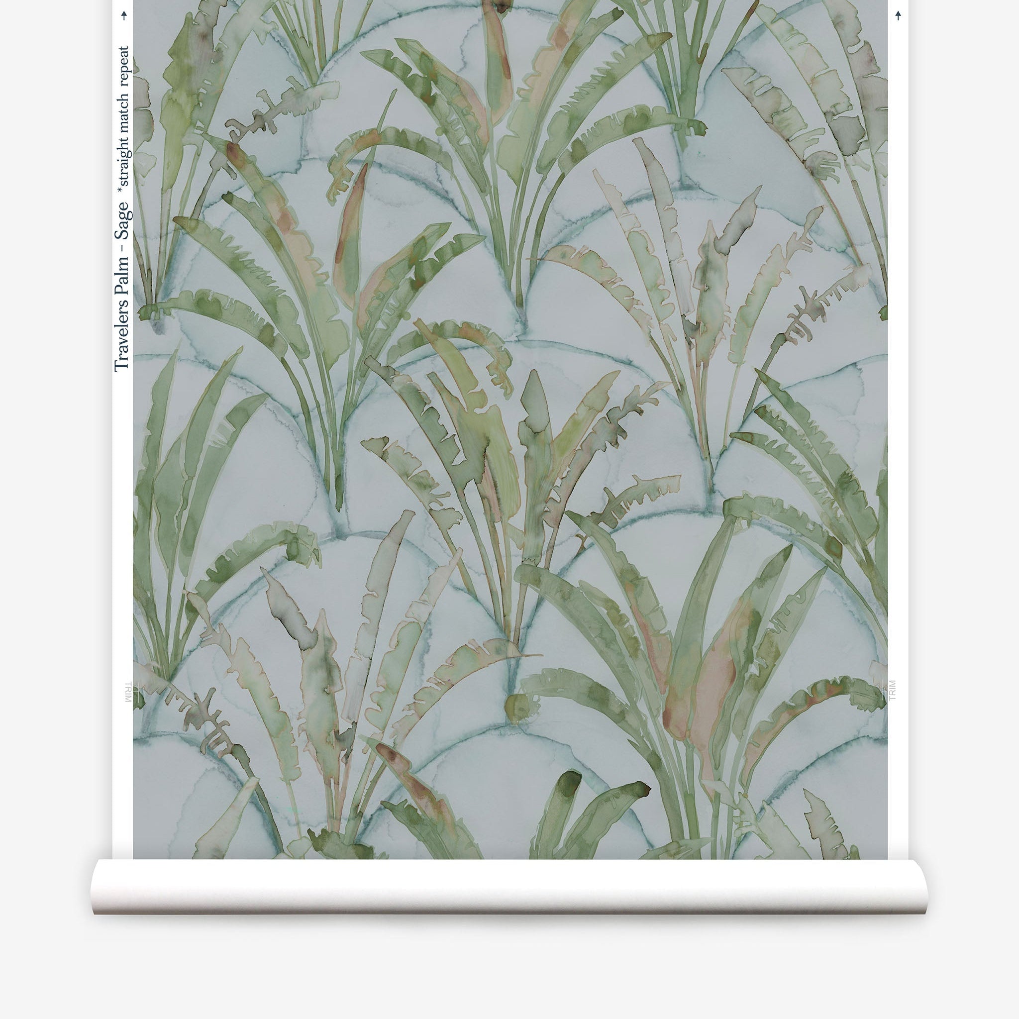 Partially unrolled wallpaper yardage in a painterly palm tree pattern in shades of green and brown on a blue-gray field.