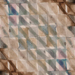 Detail of wallpaper in a painterly check pattern in shades of brown, blue and pink.