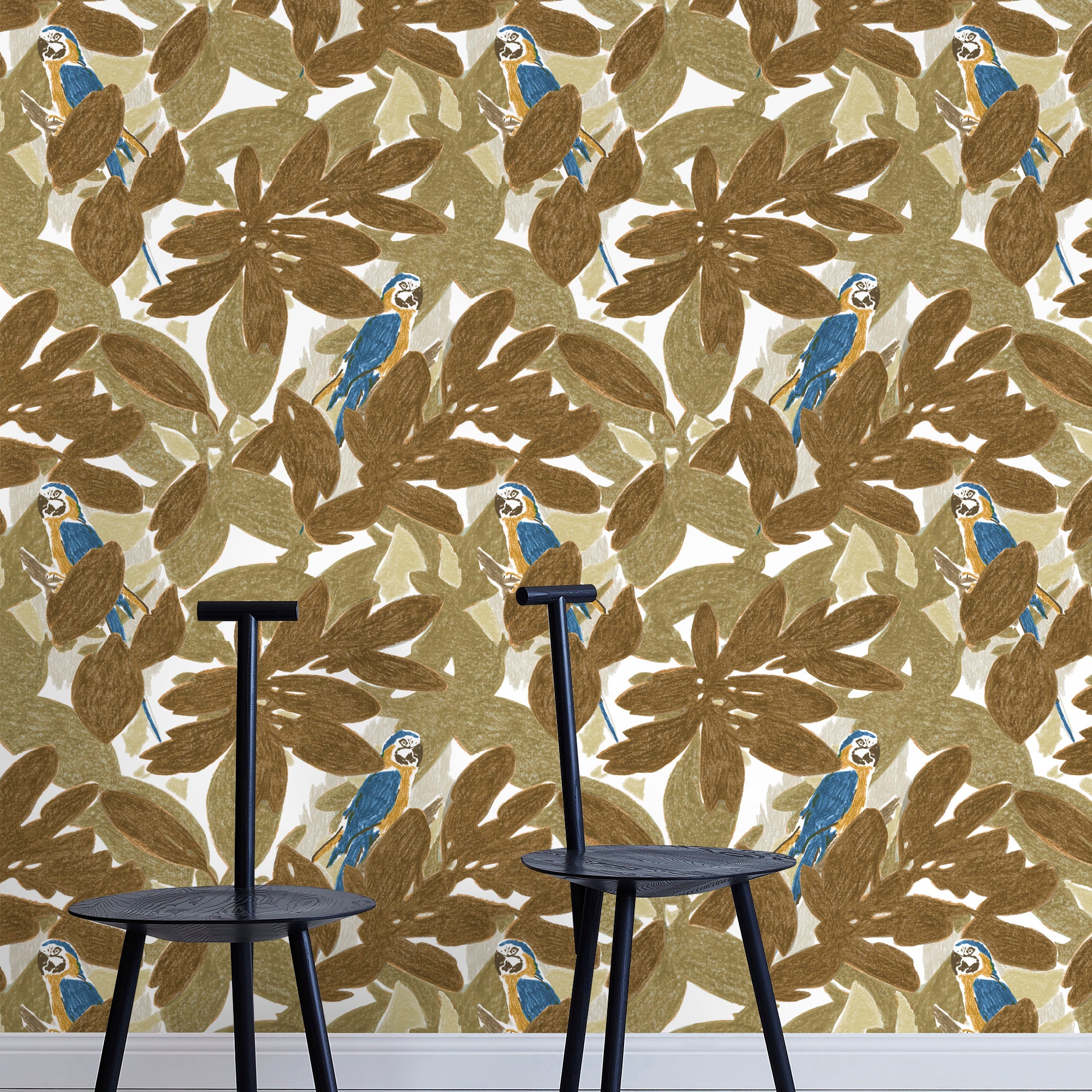 Two minimalist black chairs stand in front of a wall papered in a botanical and parrot print in bronze, brown, navy and yellow.