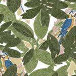 Detail of fabric in a playful botanical and parrot print in shades of green, blue and yellow on a white field.