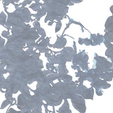 Detail of wallpaper in a watercolor floral print in shades of gray and blue on a white field.