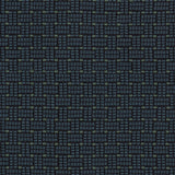 Embroidered fabric in a dashed basketweave design in navy blue with green accents.