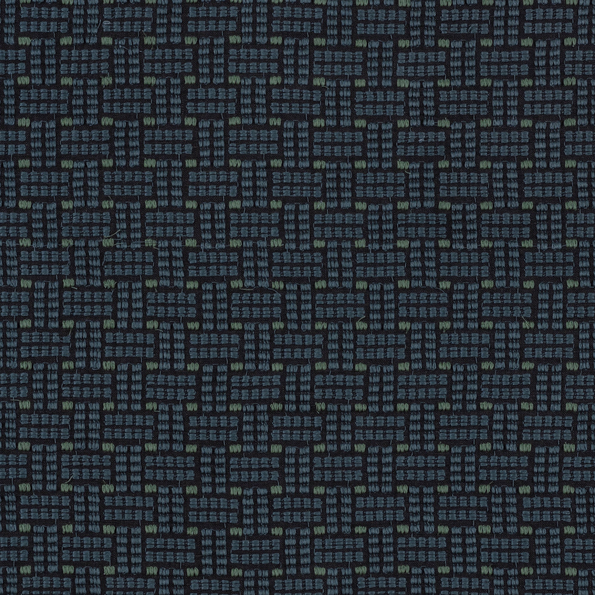 Embroidered fabric in a dashed basketweave design in navy blue with green accents.