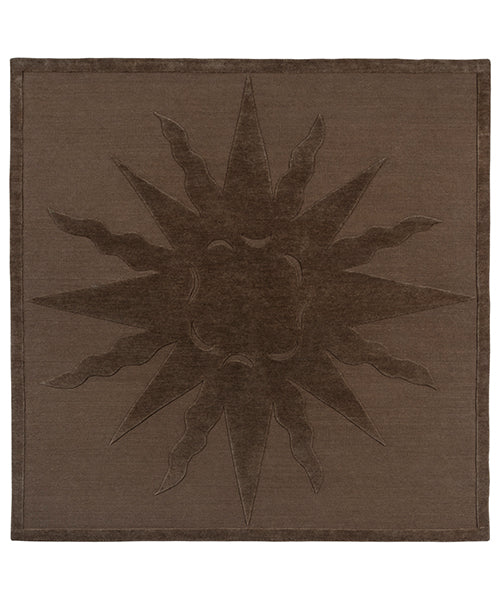 Handknotted rug with a raised sun motif in tonal brown with a thin border.