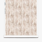 Wallpaper roll in a layered squiggle watercolor pattern in shades of pastel pink. 