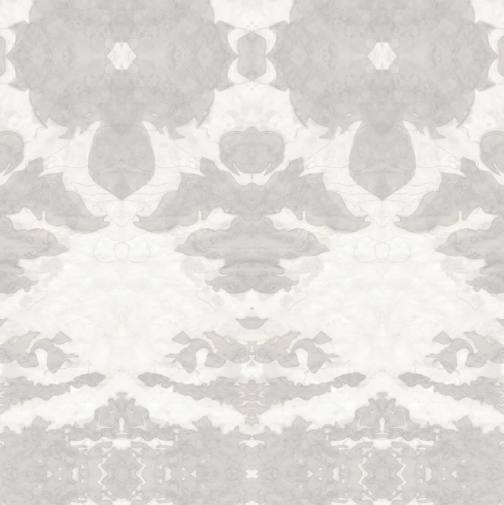 Detail of wallpaper in a painterly ikat print in shades of gray and cream.
