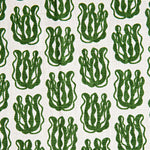 Woven fabric swatch with a repeating cartoon seaweed print in green on a white background.