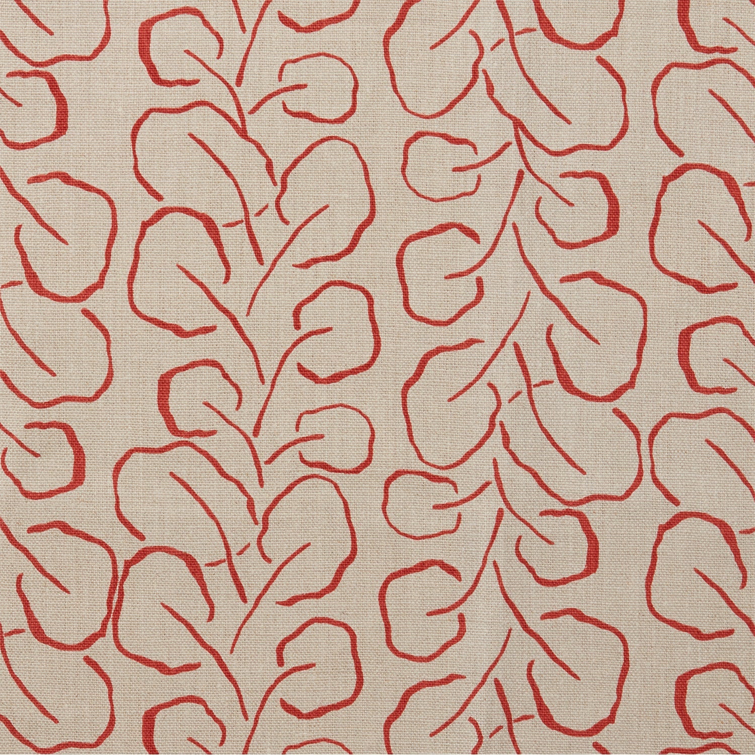 Woven fabric swatch with a large-scale repeating leaf print in red on a tan background.