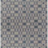 Full size Alhambra Rug in Seafret featuring pattern of linked circles that create a star like lattice in a range of pale blues, with a light green accent on a soft white field. 
