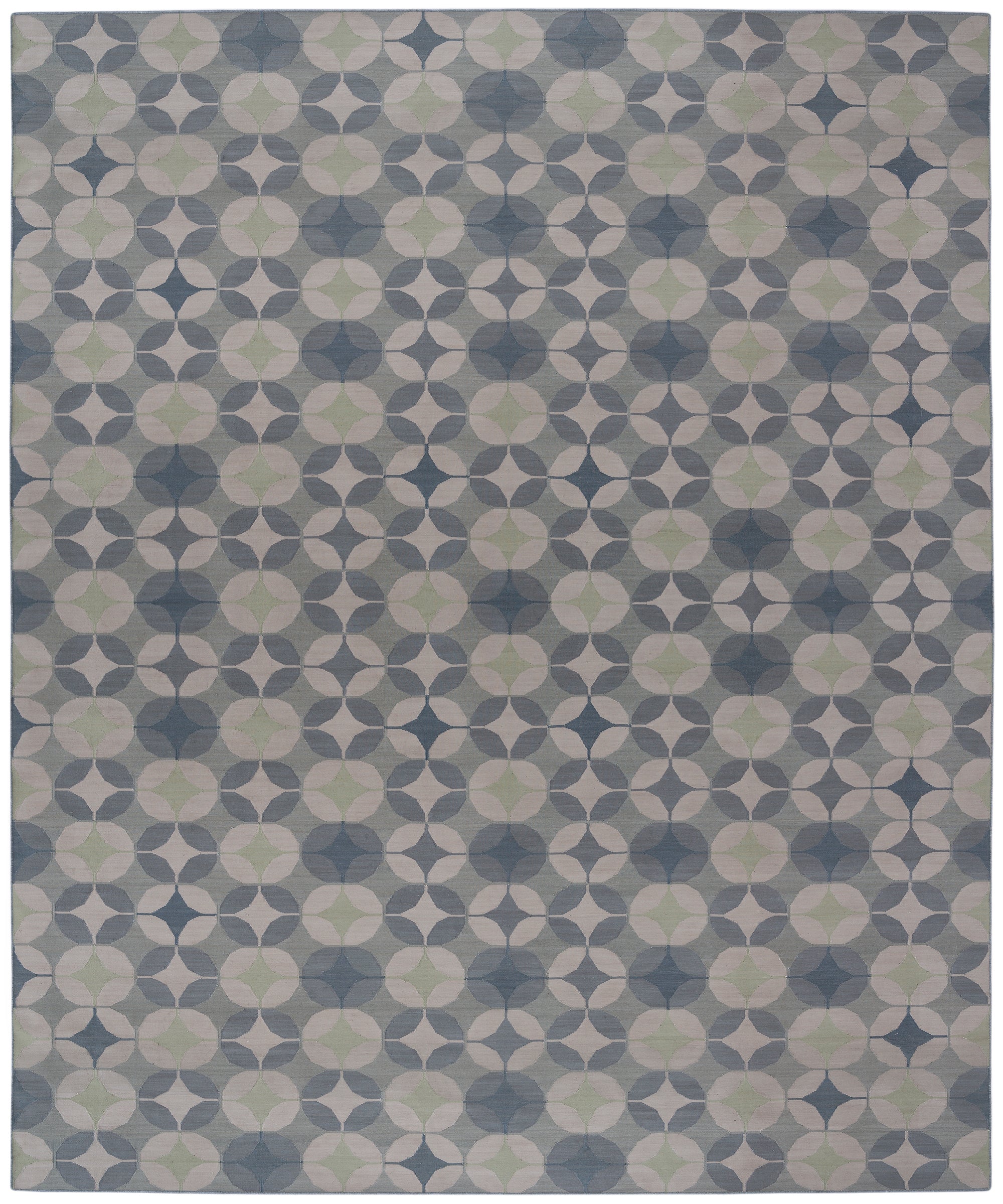 Full size Alhambra Rug in Seafret featuring pattern of linked circles that create a star like lattice in a range of pale blues, with a light green accent on a soft white field. 