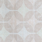 Detail of Alhambra Rug in Stonewash featuring pattern of linked circles that create a star like lattice in a range of pale pink tones a soft white field. 