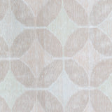 Detail of Alhambra Rug in Stonewash featuring pattern of linked circles that create a star like lattice in a range of pale pink tones a soft white field. 