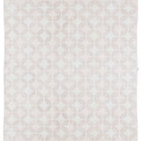 Full size Alhambra Rug in Stonewash featuring pattern of linked circles that create a star like lattice in a range of pale pink tones a soft white field. 