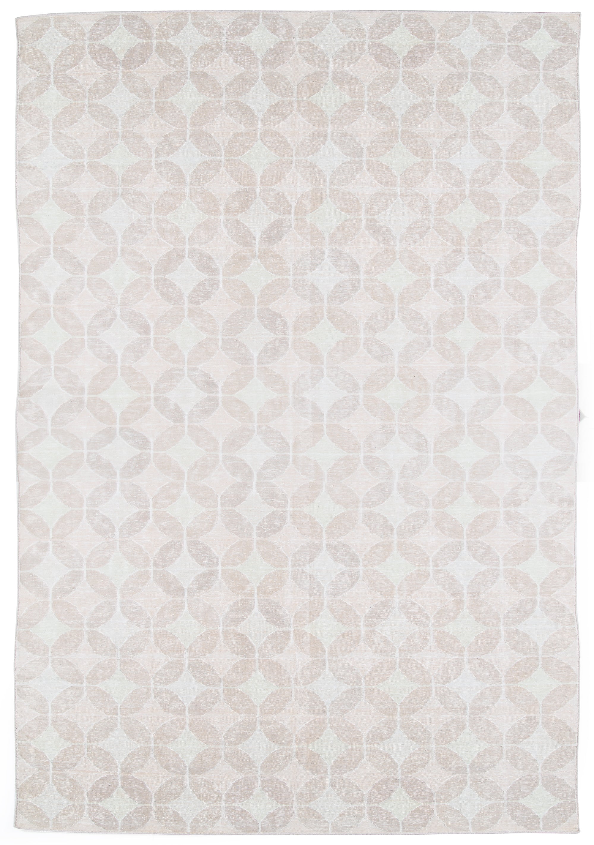 Full size Alhambra Rug in Stonewash featuring pattern of linked circles that create a star like lattice in a range of pale pink tones a soft white field. 