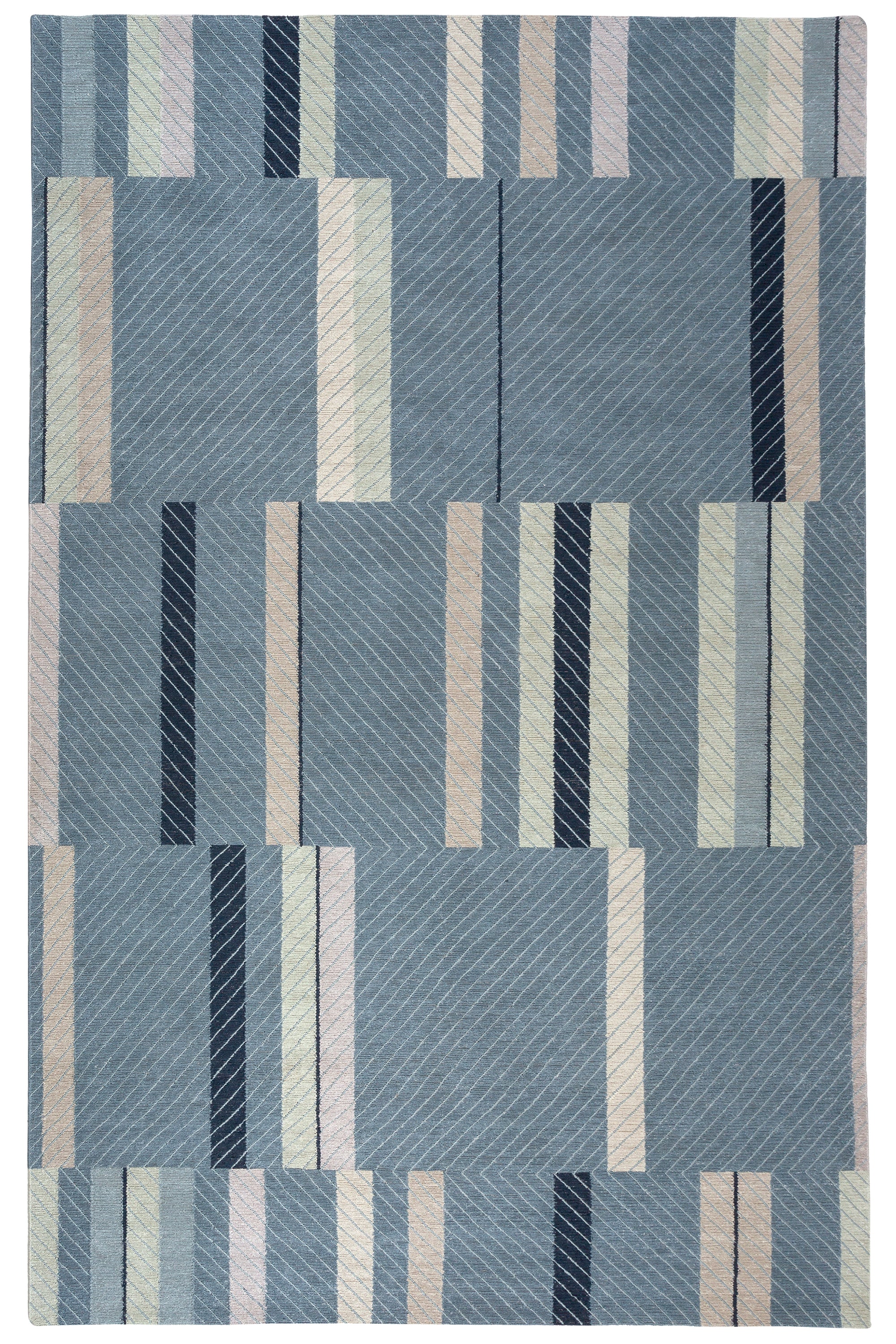 Full size Amelia Rug in Lapiz featuring a minimalist broken stripe pattern, overlayed with thin light blue diagonal lines. The broken stripes are a mix of navy blue, pale blue. white and turquoise with black accents, all on denim blue field.