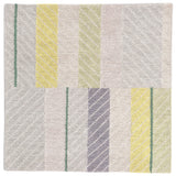 Detail of the Amelia Rug in Peridot featuring a minimalist broken stripe pattern, overlayed with thin white diagonal lines. The broken stripes are a mix of white, grey, and shades of yellow with kelly green accents, all on a light grey field. 