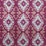 Full Size Anna Ikat rug in Cranberry features an ikat inspired pattern of diamonds in blue and white with pale lime green accents on a magenta field