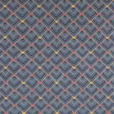 The Arrow Rug in Indigo-Coral features a dense pattern of nesting arrow shapes in shades of blue with accents of coral and yellow on a light brown field