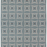 Full size Boe rug in Argento, featuring a pattern of white curved segments with taupe circles on a blue field. 