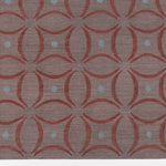 Detail of the Boe rug in Tivoli, featuring a pattern of crimsoncurved segments with light blue circles on a heather purple field. 