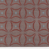 Detail of the Boe rug in Tivoli, featuring a pattern of crimsoncurved segments with light blue circles on a heather purple field. 