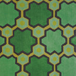 Detail of the Cordoba Cut Pile Rug in Emerald, a hexagonal lattice pattern with sahdes of emerald, jade, yelow and chcolate brown. 