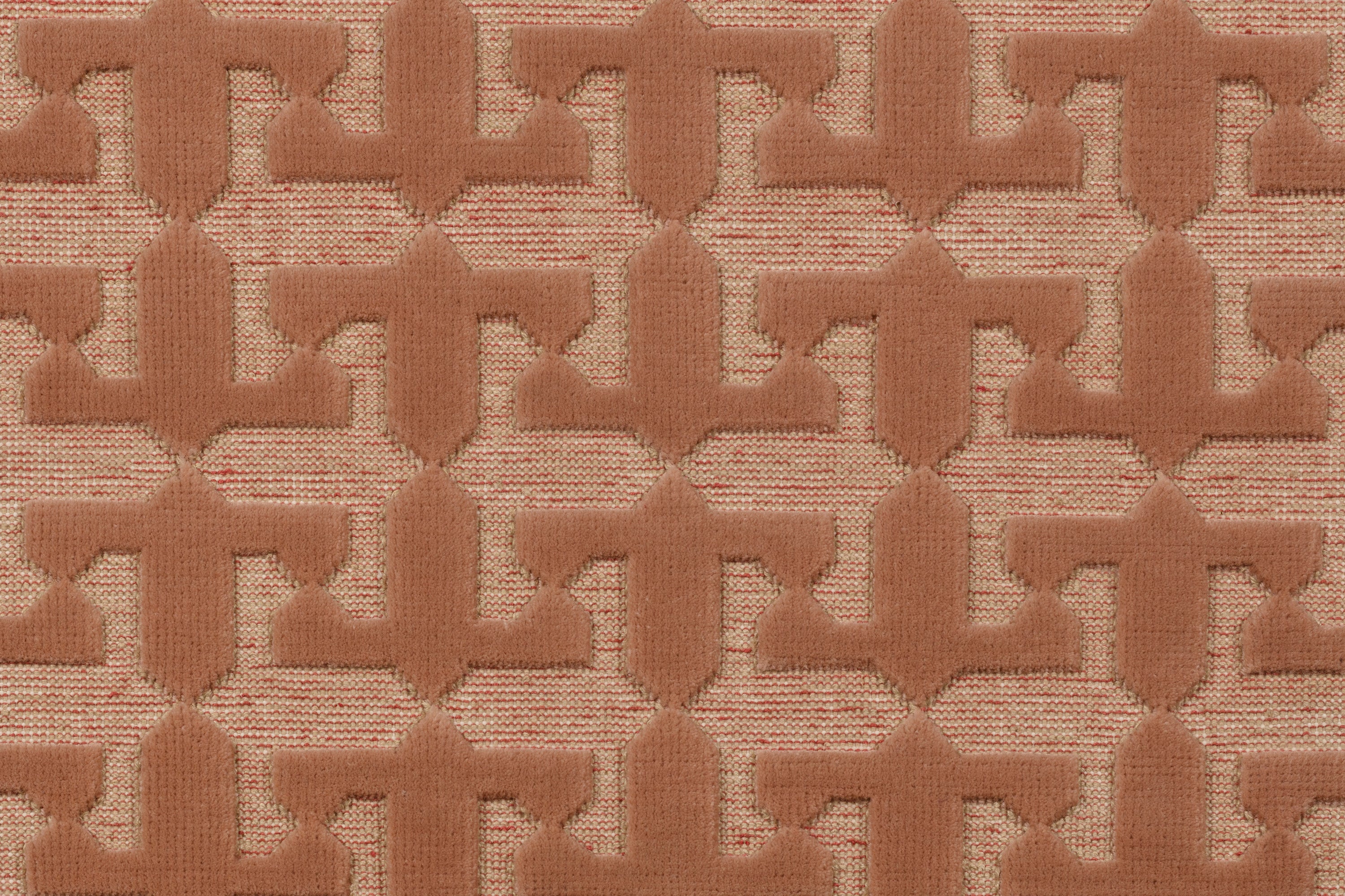 Detail of the Iseo Rug in Conch, a textural monochromatic abstract geometric pattern in terracotta coral color. 