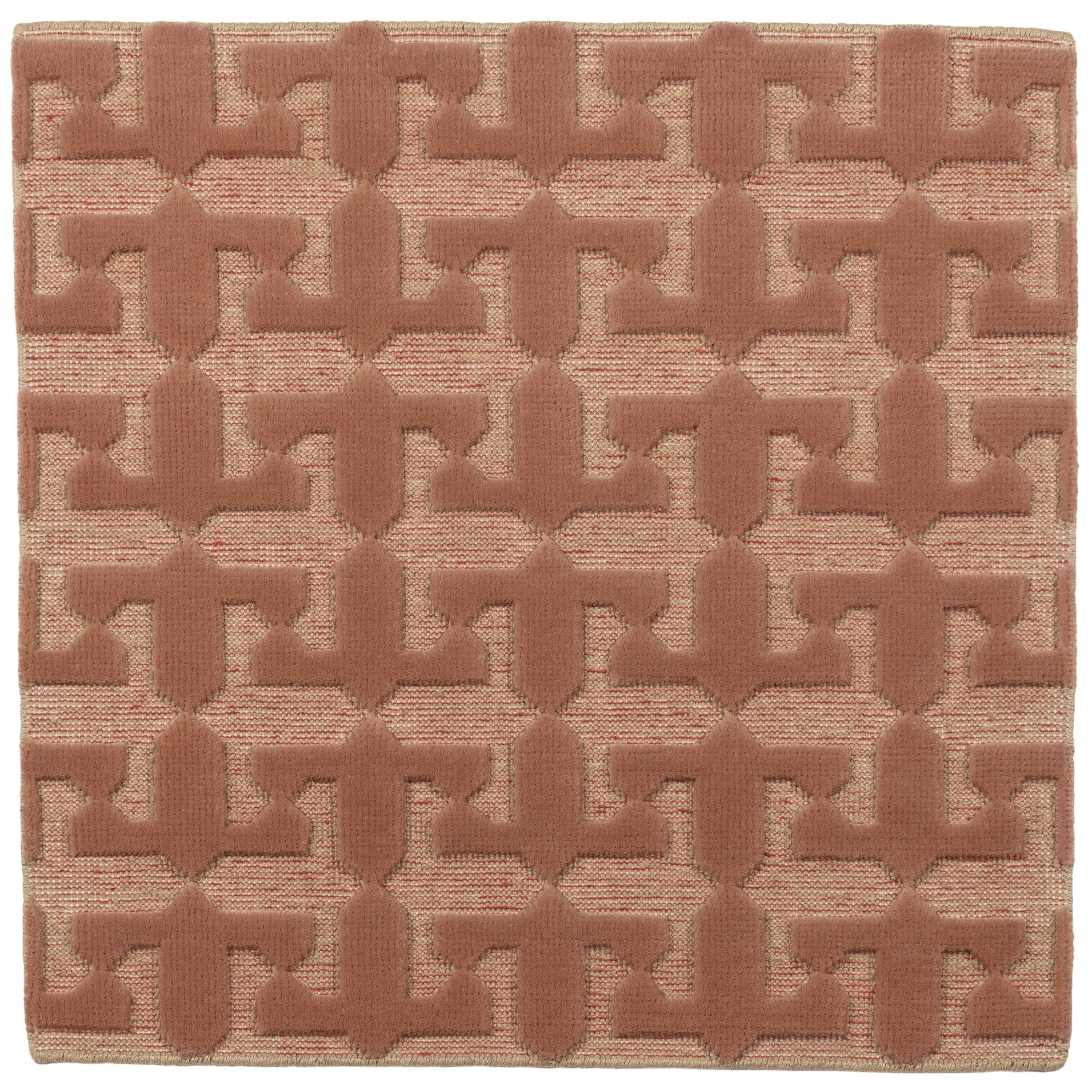Detail of the Iseo Rug in Conch, a textural monochromatic abstract geometric pattern in terracotta coral color. 