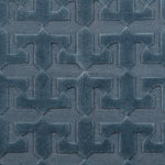 Detail of the Rug in Stormy Sky, a textural monochromatic abstract geometric pattern in blue. 