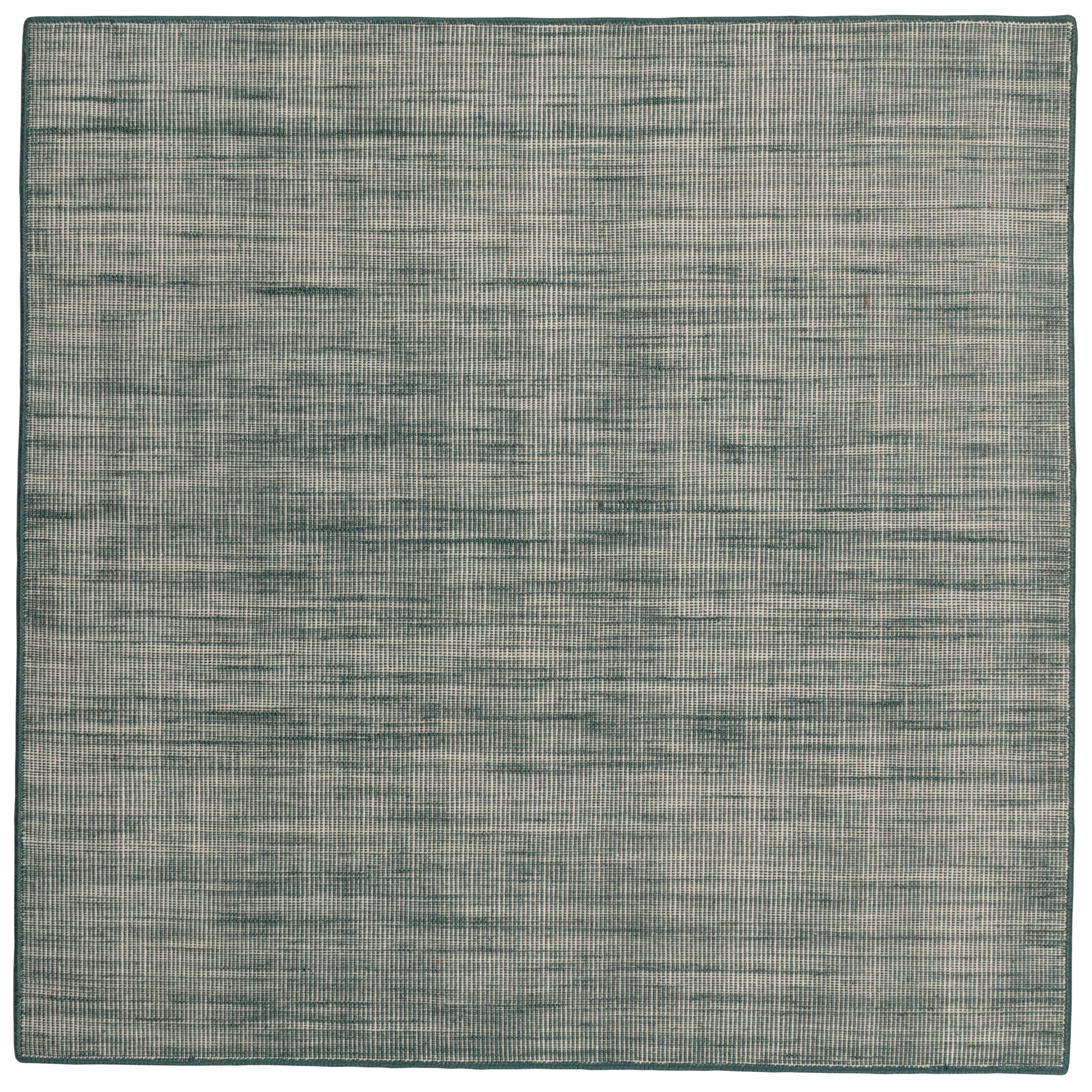 Sample of the Moire Rug in Sea Breeze, a subtle striated pattern in teal and off white. 