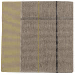 Detail of the Jasper Waffle Rug in Peridot, a large scale plaid pattern of ecru, yellow, grey and off white. 