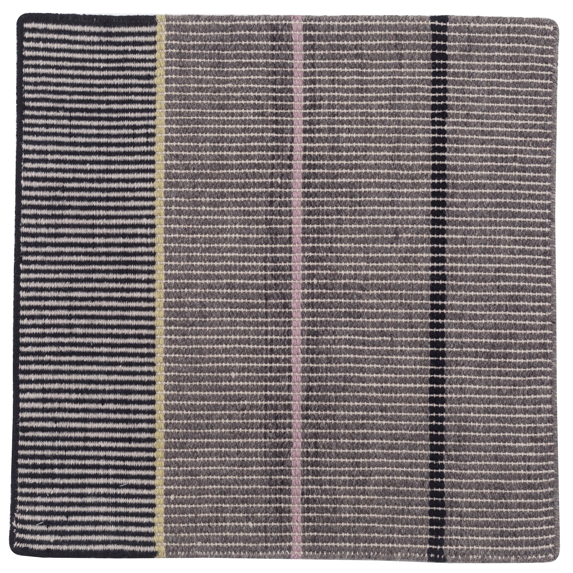 Detail of the Jasper Waffle Rug in Jet, widely spaced thin stripes of yellow, pink, black, acqua and white on a grey field. 