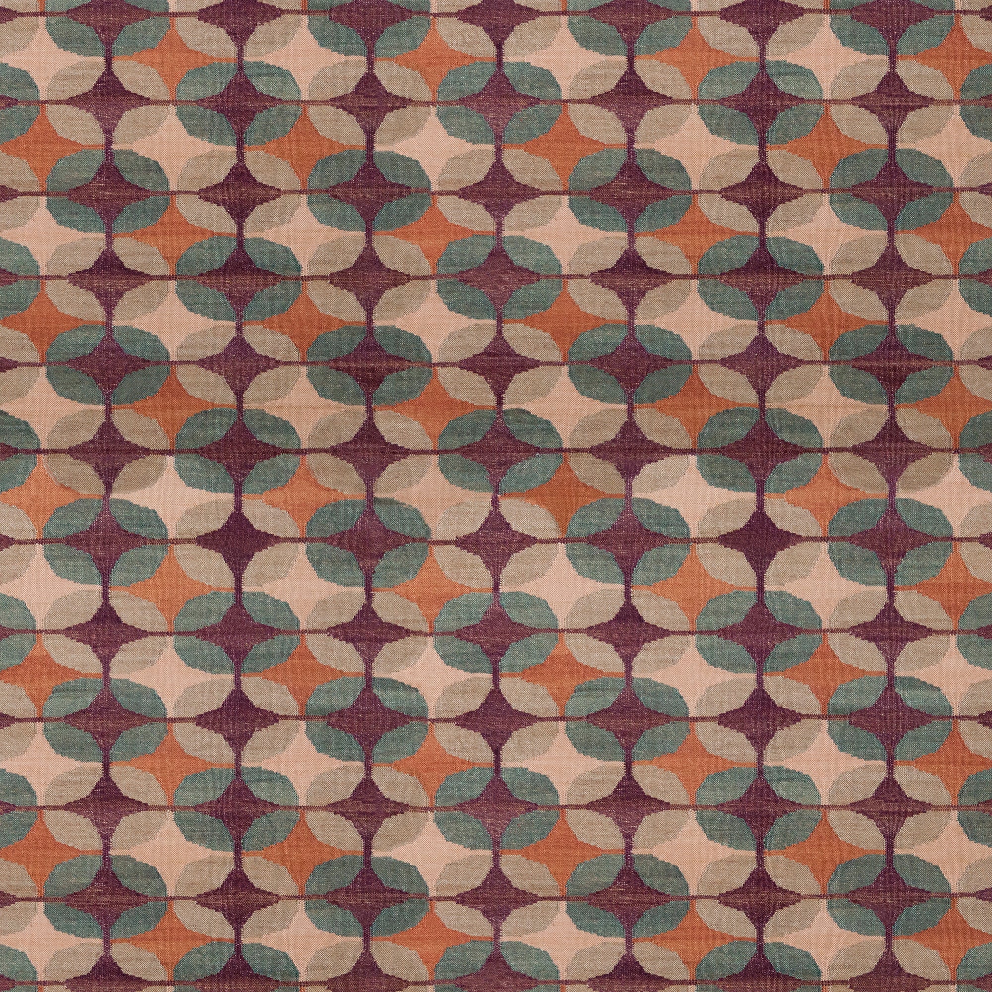 Petite Alhambra Rug featuring a pattern of linked circles that create a star like lattice in coral, taupe, turquoise and royal purple. 