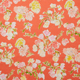 Linen swatch with a pattern of large-scale line-drawn flowers in gray ink with red, pink and yellow watercolors, on a red background.