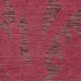 Detail of Capri Rug with a large abstract design shades of pink over varied stried lighter color background