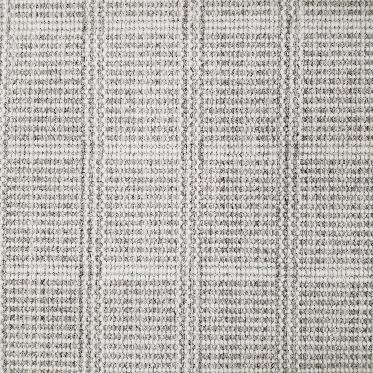 Wool broadloom carpet swatch in a plaid print in shades of gray, light blue and cream.