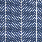 Wool broadloom carpet swatch in a woven chevron pattern in navy and white with white accent stripes.