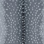 Wool-nylon broadloom carpet swatch in an antelope print in cream on an ombré gray field.