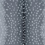 Wool-nylon broadloom carpet swatch in an antelope print in cream on an ombré gray field.