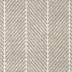 Wool broadloom carpet swatch in a herringbone stripe in tan and cream.