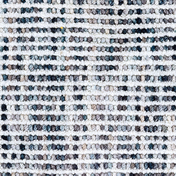 Wool broadloom carpet swatch in a looped stripe weave in white, blue and gray.