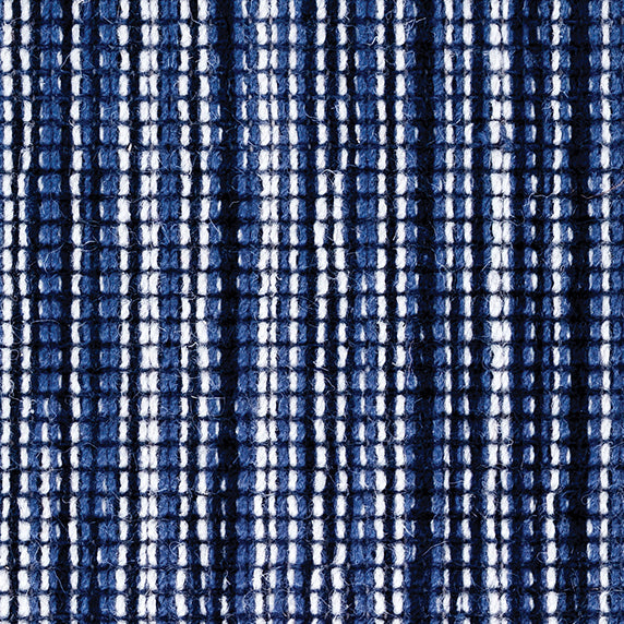 Wool broadloom carpet swatch in a multicolor stripe in shades of charcoal, navy and white.