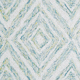 Wool broadloom carpet swatch in a painterly diamond pattern in white and blue speckled with lime green.