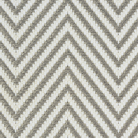 Outdoor broadloom carpet swatch in a herringbone weave in gray and cream.
