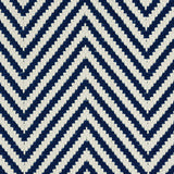 Outdoor broadloom carpet swatch in a herringbone weave in navy and cream.